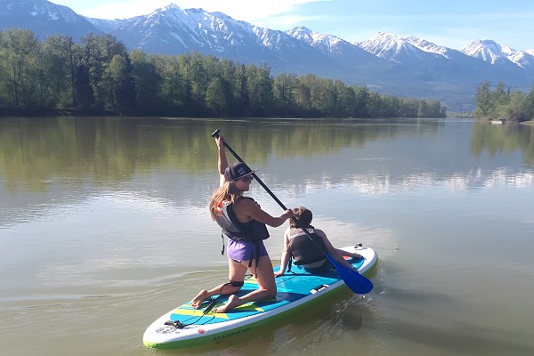 Woman on paddleboard in Golden BC